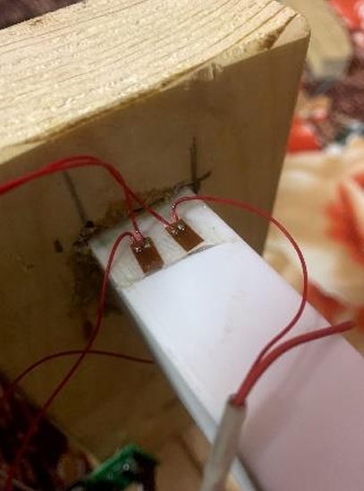 Strain gauges bonded to PLA C-beam surface for experimental stress measurement