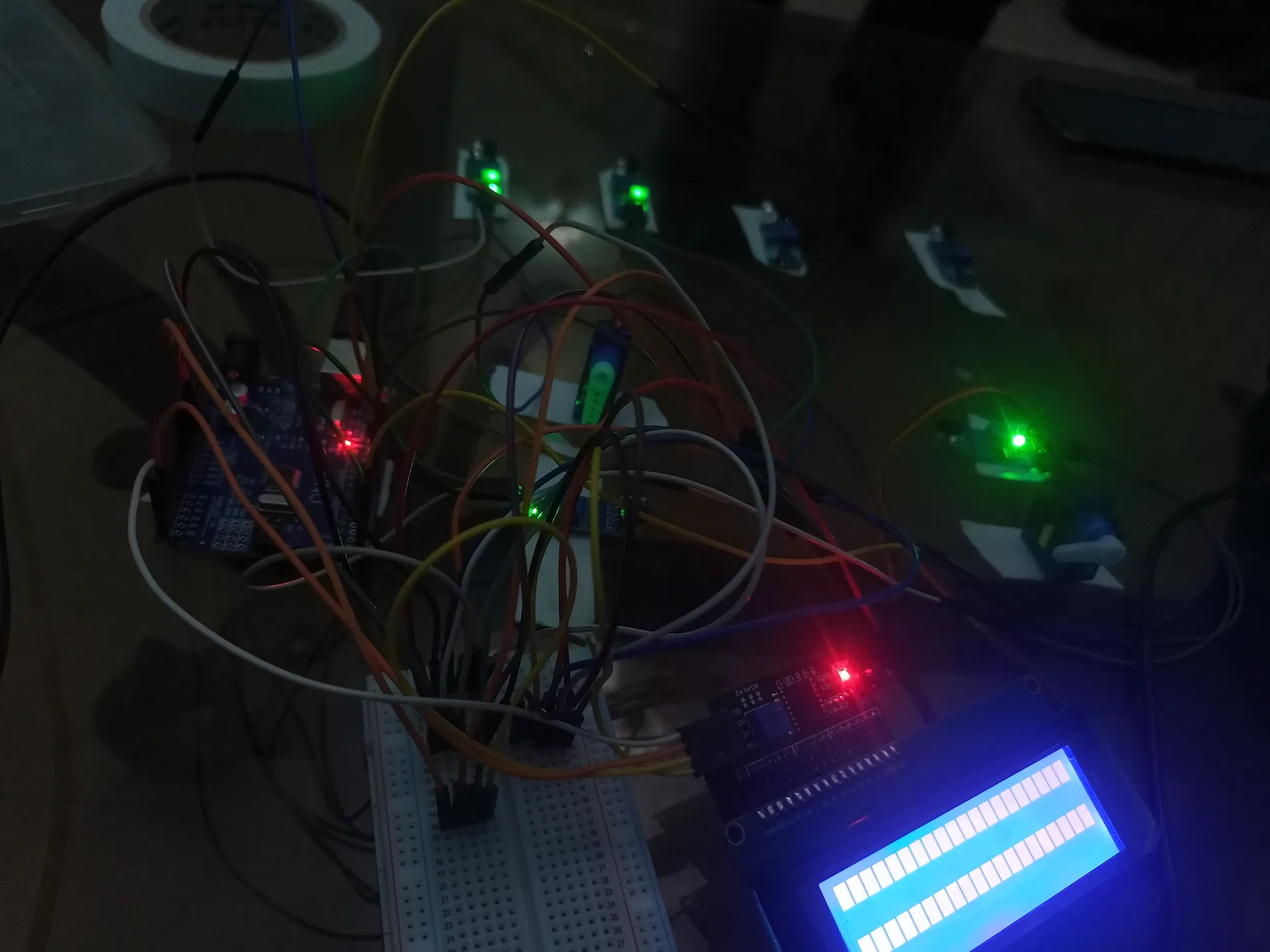 IoT smart parking system circuit in progress — Arduino, NodeMCU, IR sensors, LEDs and breadboard connections